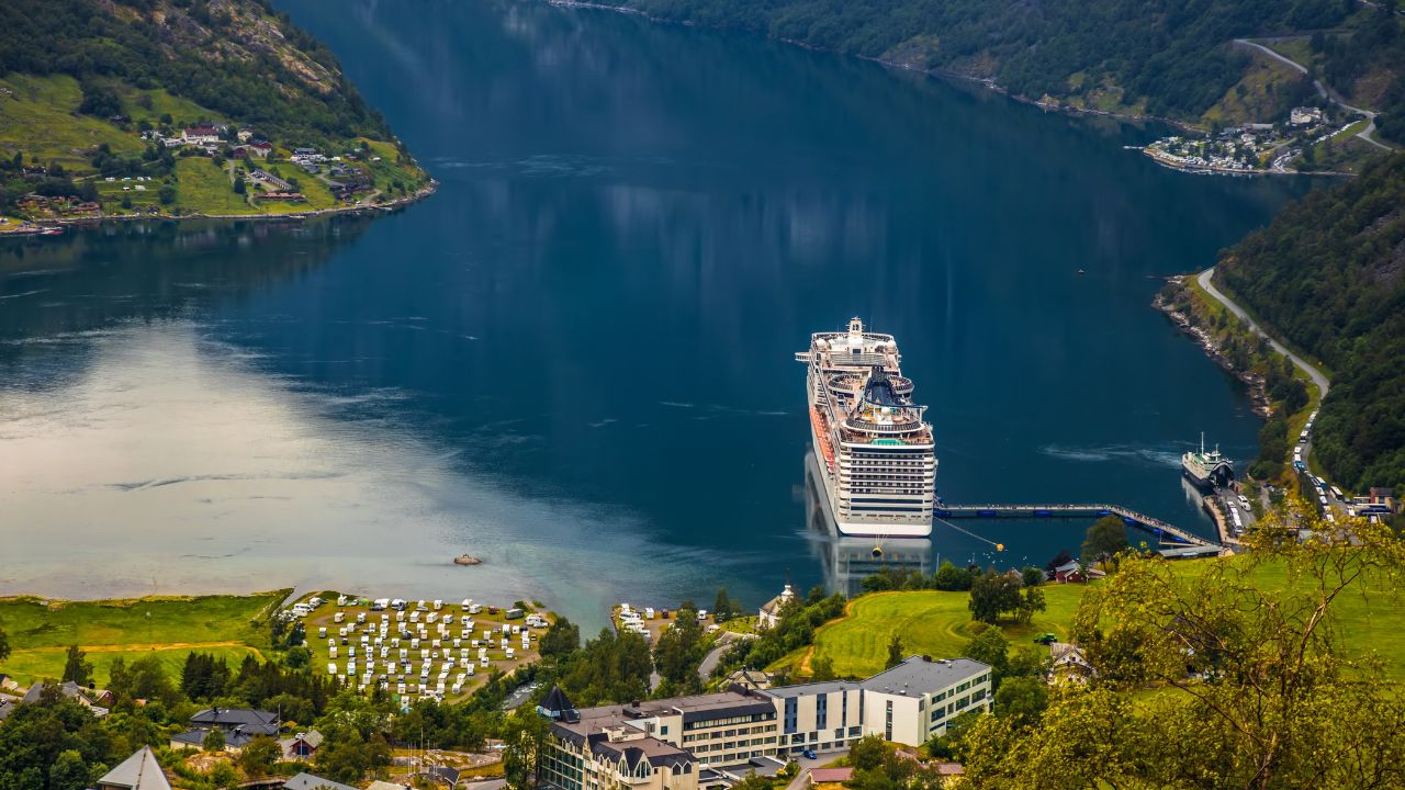 Cruise Ship, Cruise Liners On Geiranger fjord, Norway. The fjord is one of Norway's most visited tourist sites. Geiranger Fjord, a UNESCO World Heritage Site