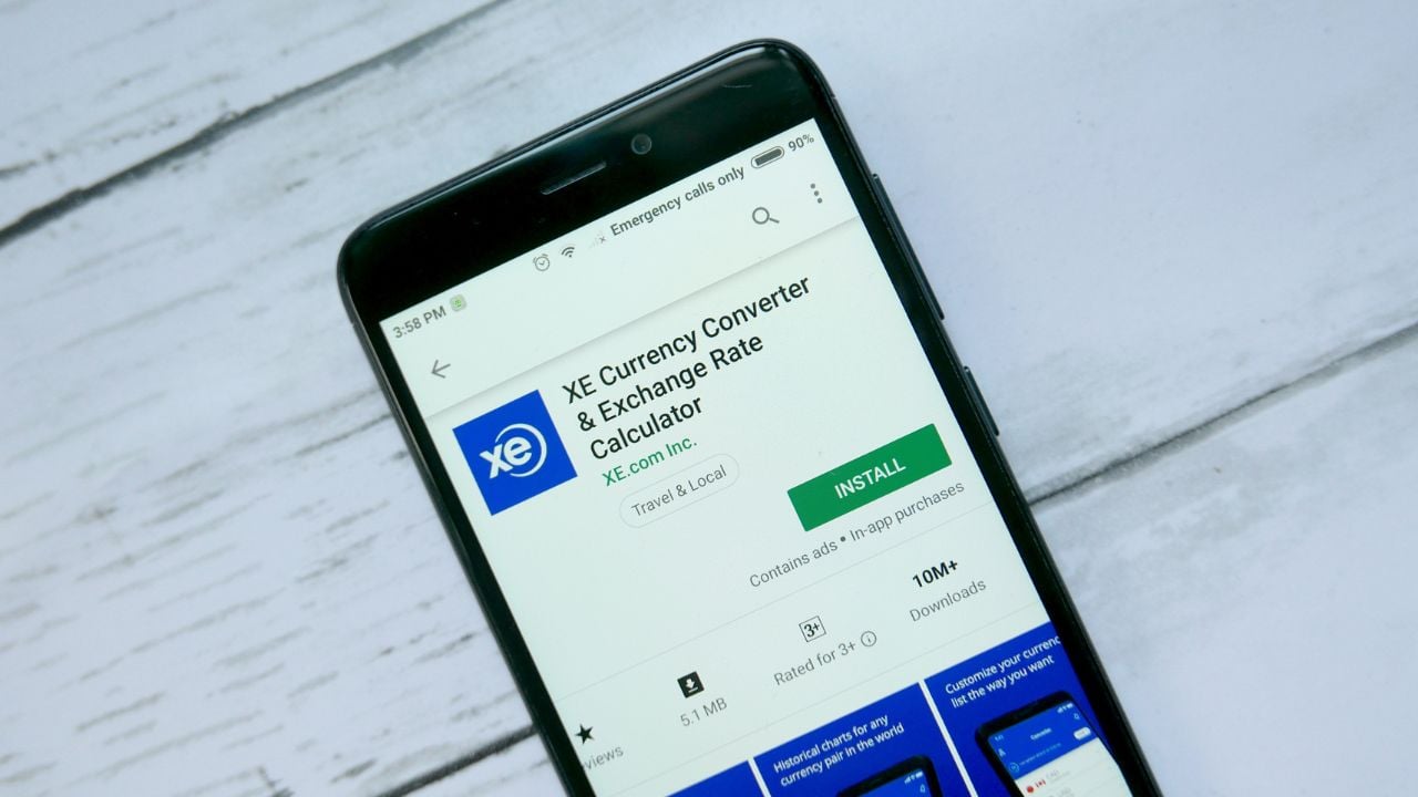 XE currency converter app shown on a phone screen.