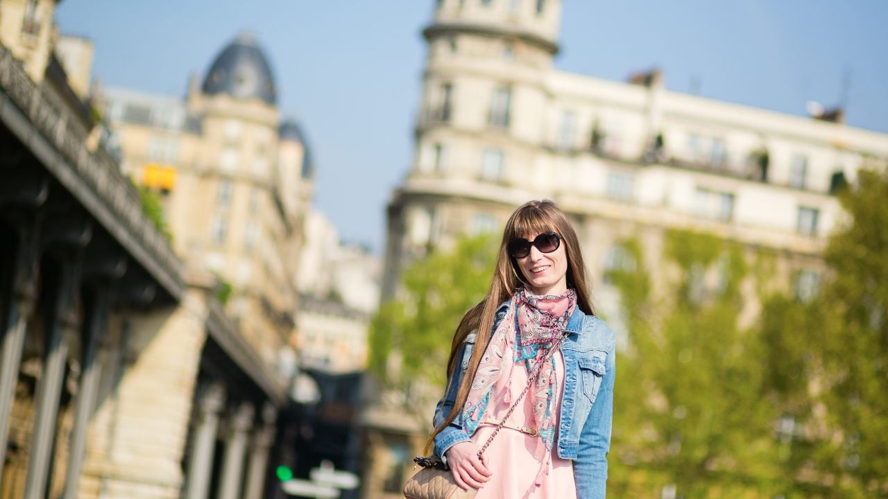 Beautiful young girl walking in Paris
