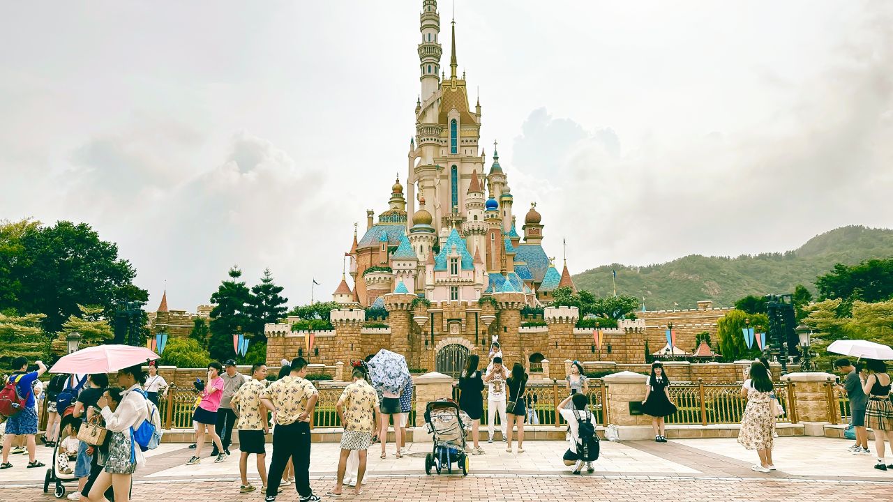 Tsuen Wan, Hong Kong - July 18, 2023 : Visitors At Disneyland Resort Hong Kong With Castle of Magical Dreams In Central Area.