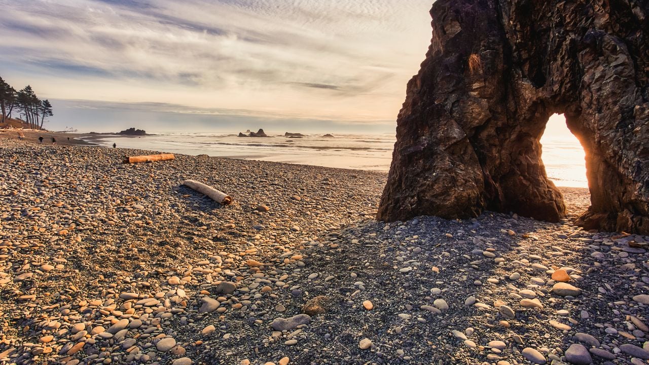 Sunset through sea stacks at Ruby Beach in Olympic National Park, Washington.