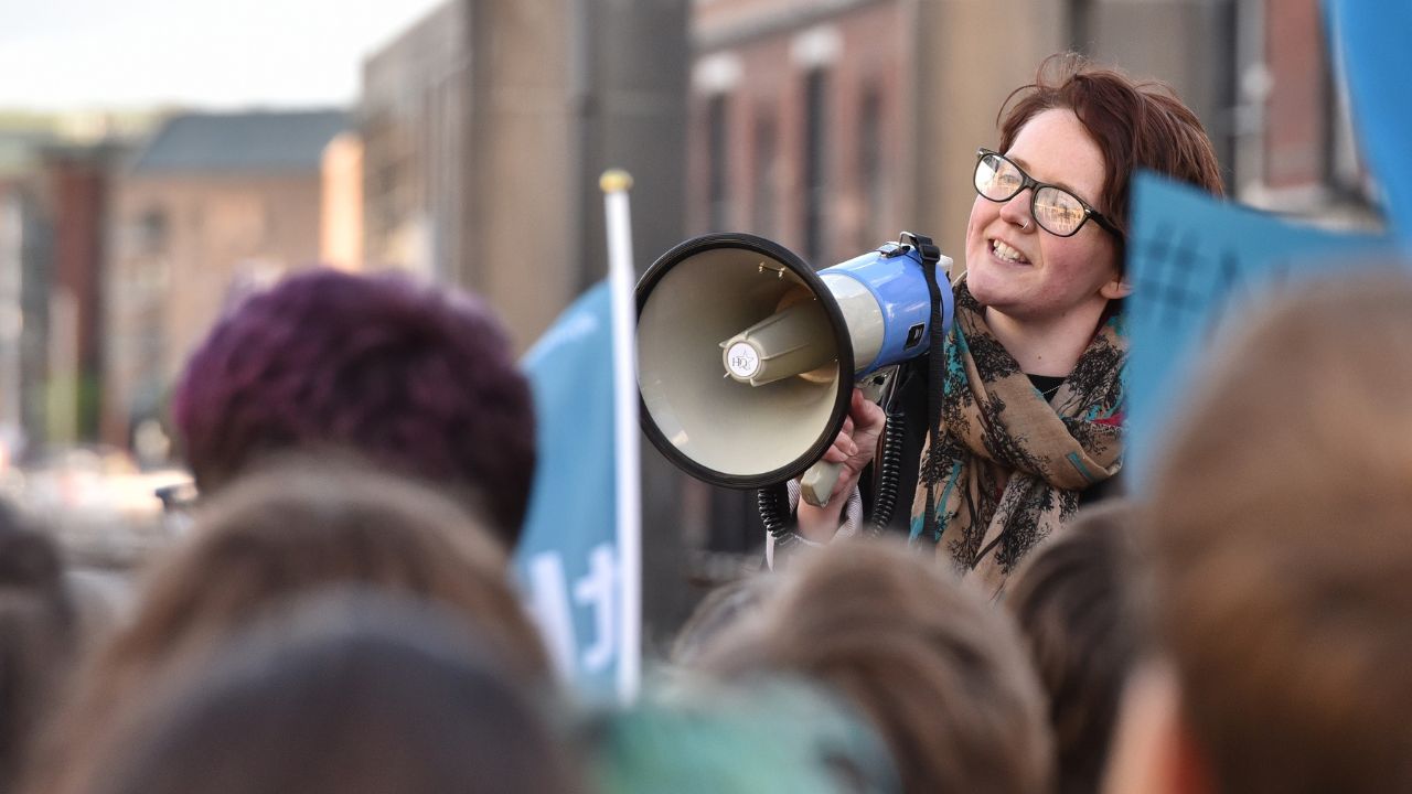 Protest leader speaking through a megaphone.