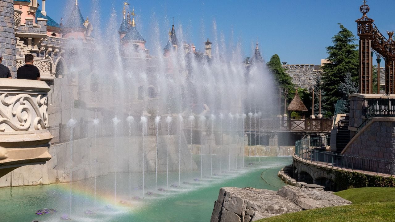 PARIS, FRANCE - Aug 11, 2022: A closeup shot of water fountains in front of Disneyland Paris' Castle