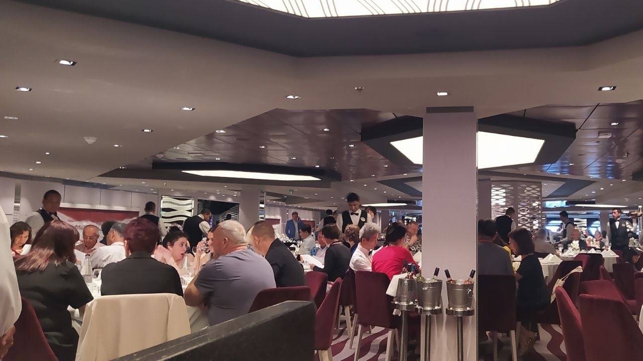 Passengers dining in a cruise ship restaurant