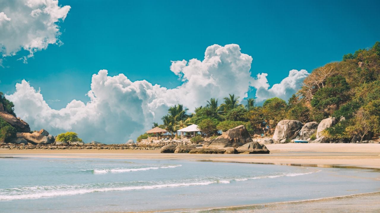 Palolem Beach in Goa, India, under a sunny sky
