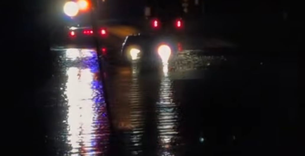 car in flooded overpass rescued