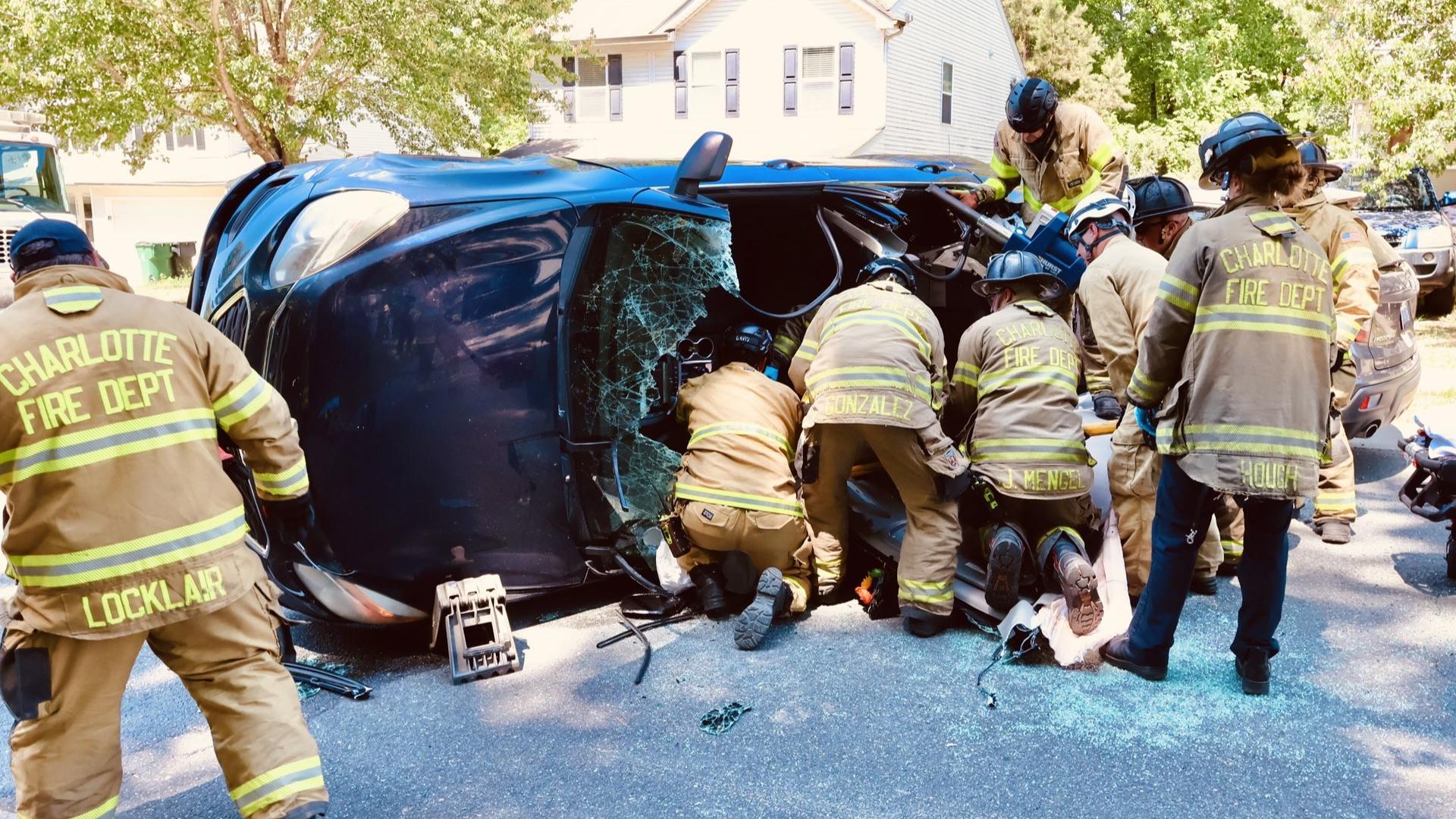 car on its side fire rescue