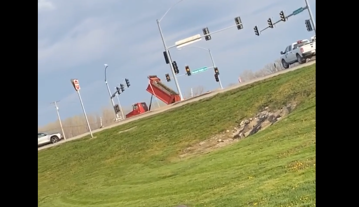 dump truck bed raised violation