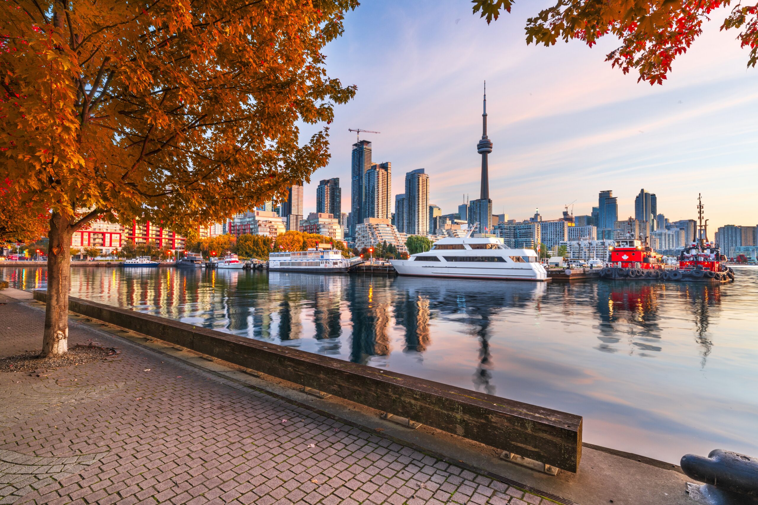 Toronto, Ontario, Canada downtown city skyline at twilight in autumn season.