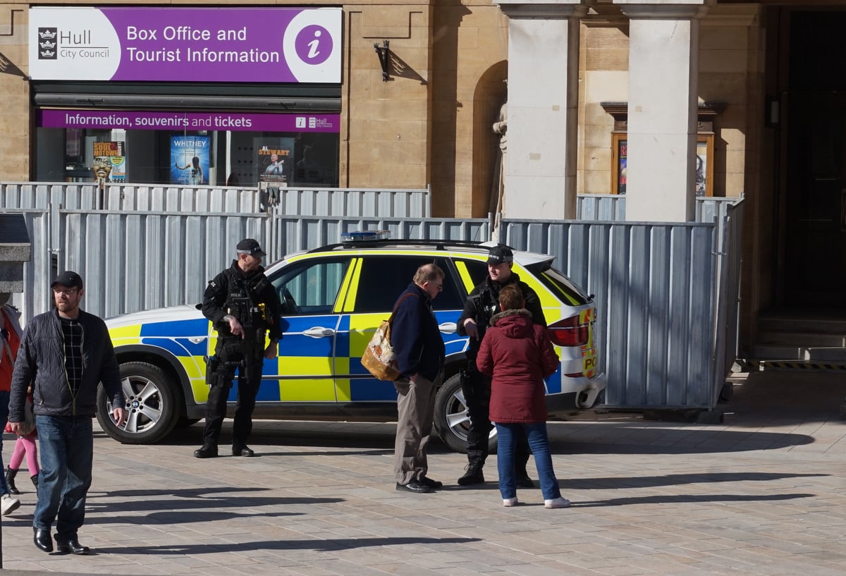 Armed police in Victoria Square, Hull .