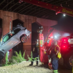 BMW Takes an Unexpected Swim After Highway Crash in New Jersey, Driver Found Hiding Under Train