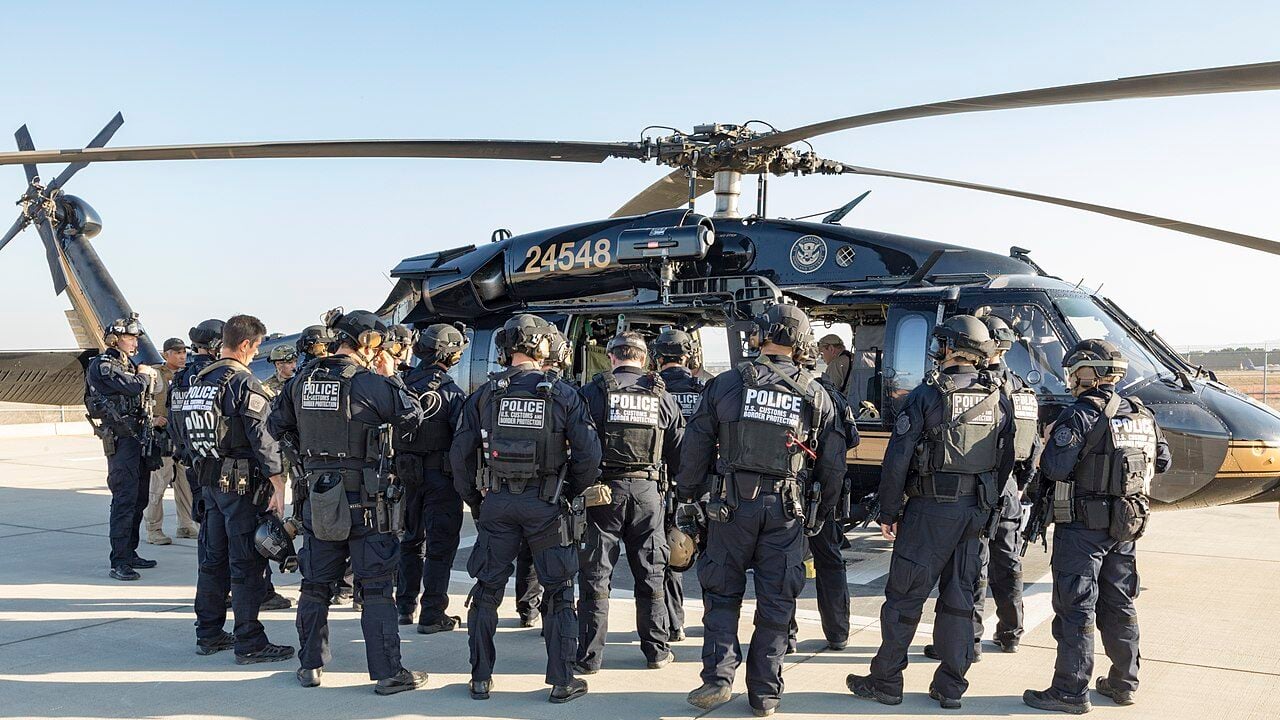 Office of Field Operations Special Response Team Members from the Los Angeles and San Diego Field Offices work together with Agents from the San Diego Branch of Air and Marine Operations to train and qualify in Helicopter Rope Suspension Techniques.