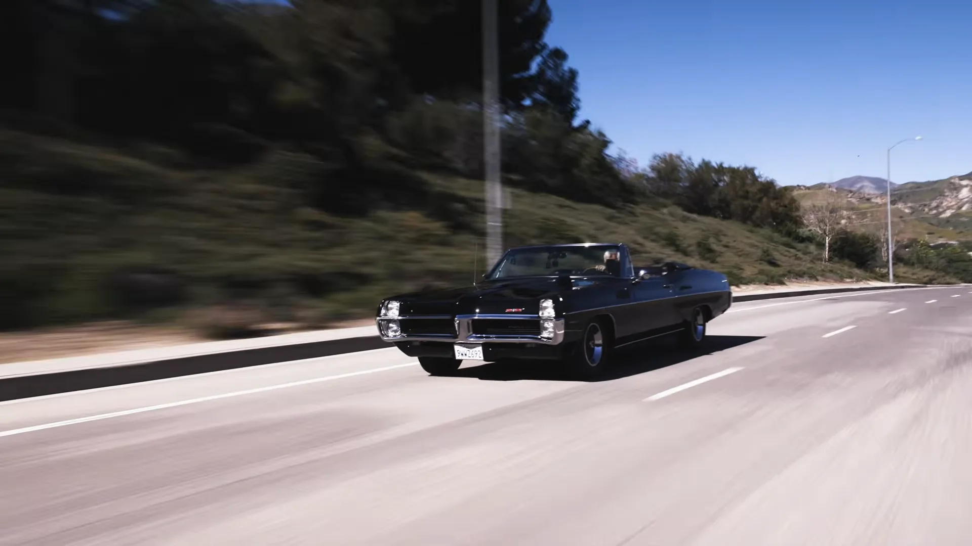 Jay Leno with his 1967 Pontiac 2+2 HO Driving
