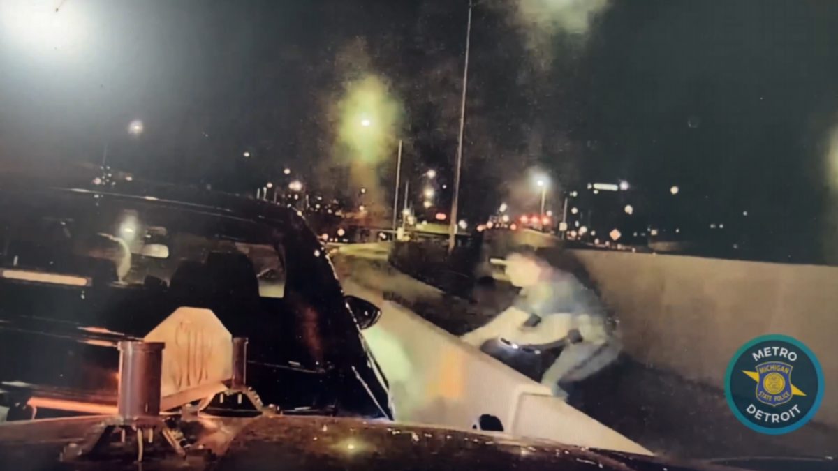 Michigan Cop Narrowly Avoids Being Hit Twice on Freeway