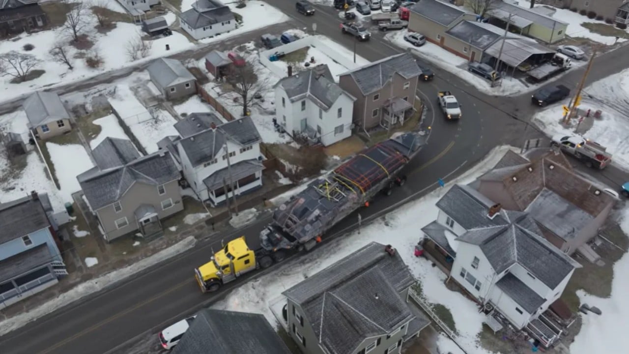 Navy SEAL boat on truck navigating the streets