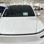 He drives with his feet. Tesla’s FSD gave him freedom. But is that legal?