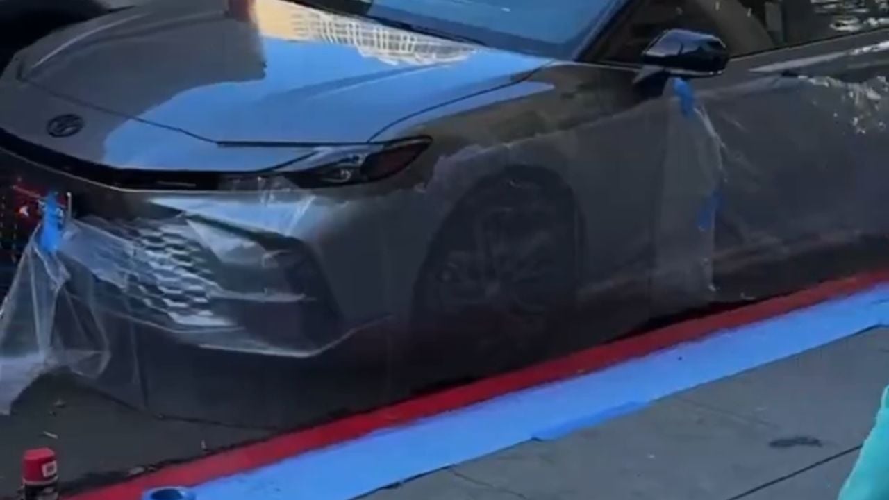 Red paint on a grey sedan, a worker who wouldn't stop, and an owner who lost it. Viral gold.