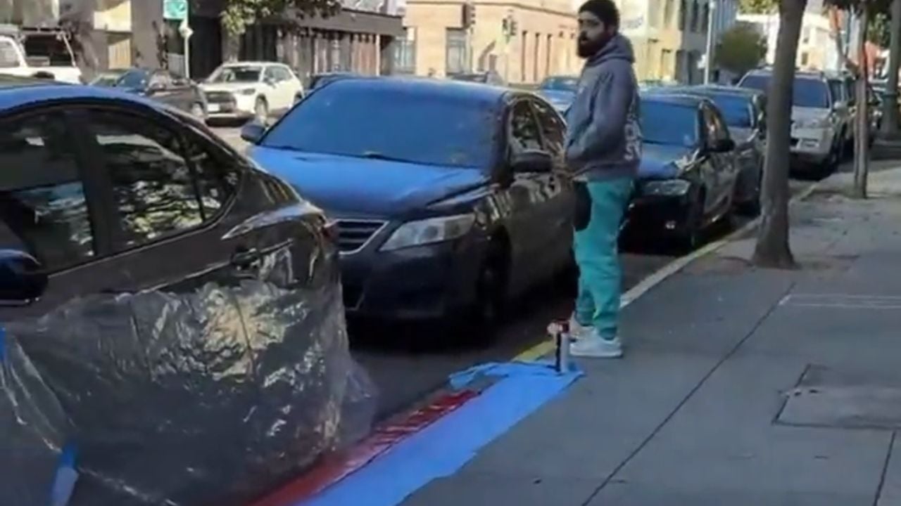 Red paint on a grey sedan, a worker who wouldn't stop, and an owner who lost it. Viral gold.