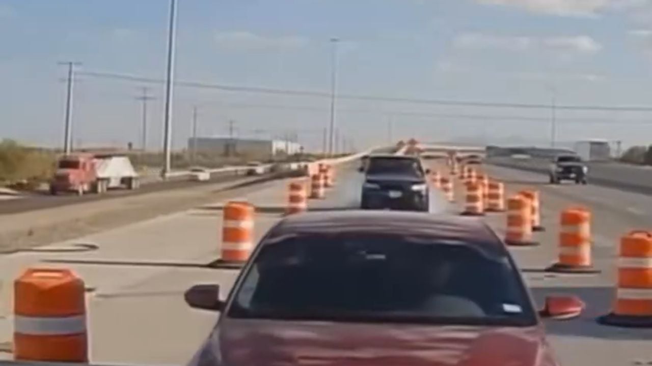 He was stopped in traffic. Then he looked in his rearview mirror.