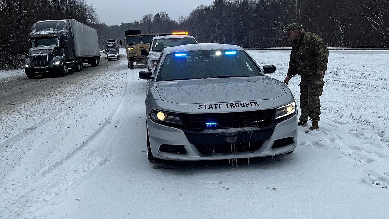 North Carolina Highway Patrol help stranded motorists in Surry County, North Carolina during Winter Storm Izzy, Jan. 16, 2022.