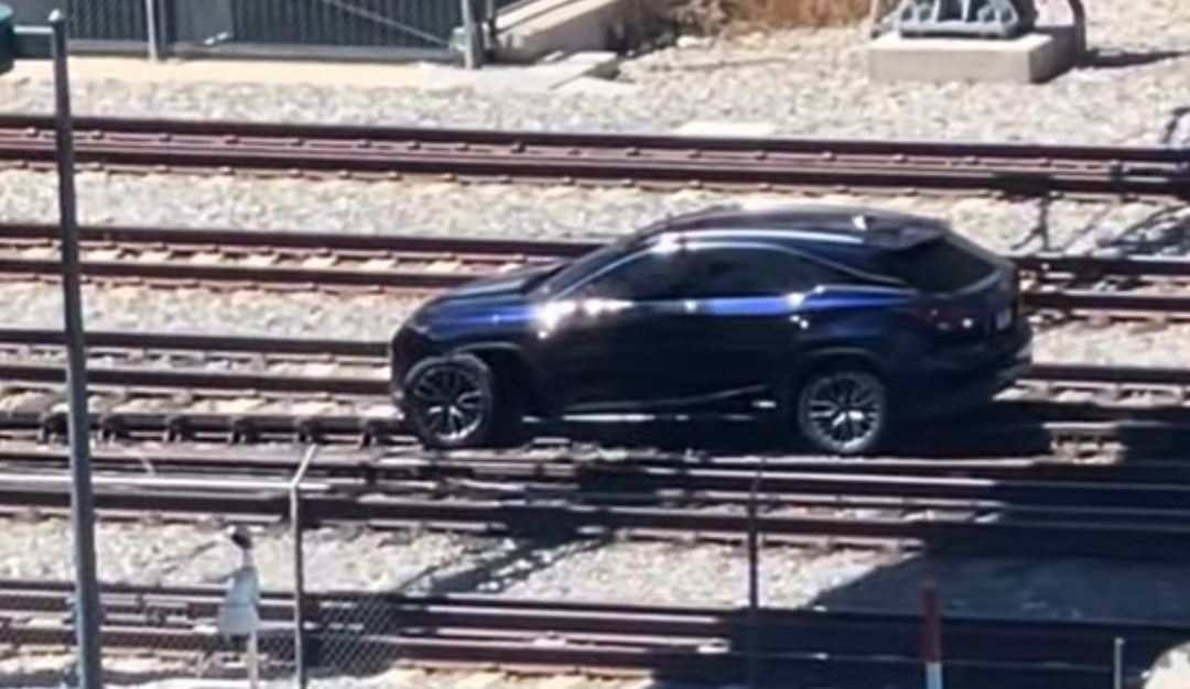 suv stuck on railroad tracks