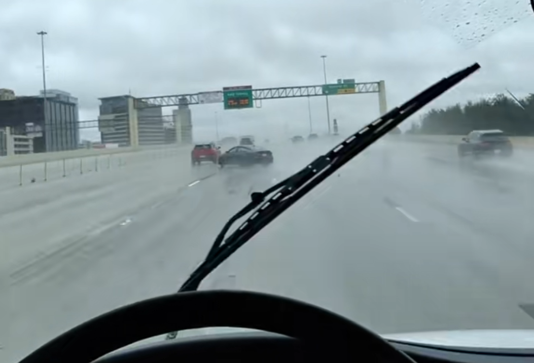 man swerving in rain in houston