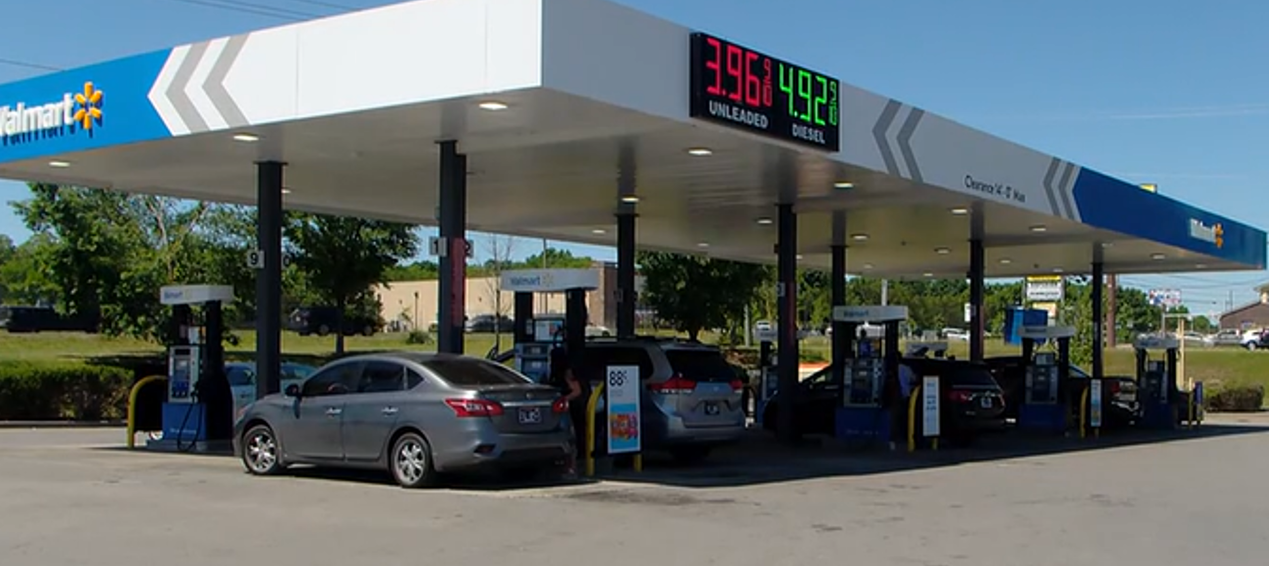 woman sliding car theft at gas station