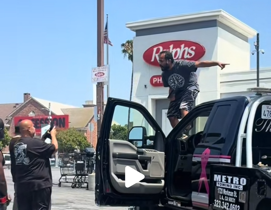 man points and screams at tow truck company