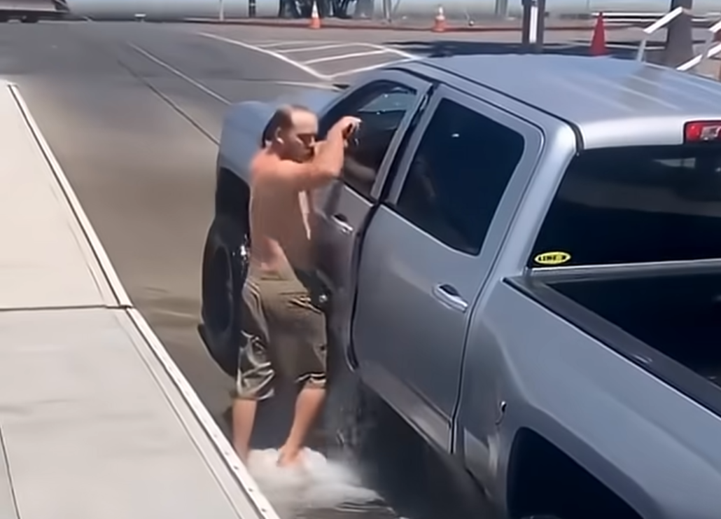 man with sinking chevy truck