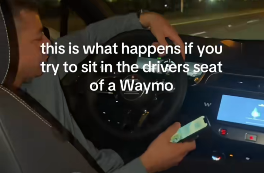 man gets in front seat of waymo