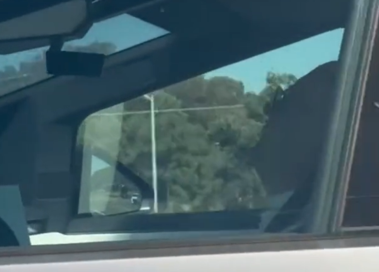 man asleep in cybertruck