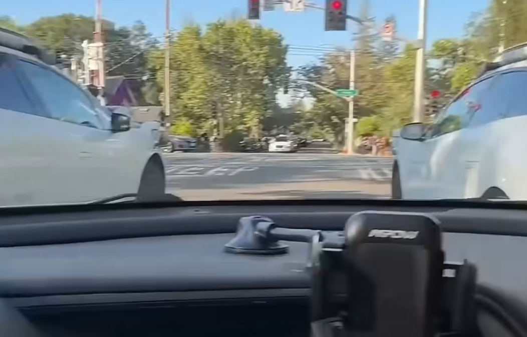 woman stuck behind two waymo