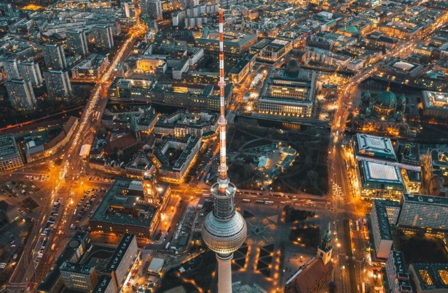 Wide View of Beautiful Berlin, Germany Cityscape after Sunset with lit up Streets and Alexanderplatz TV Tower, Aerial Drone View circa September 2019