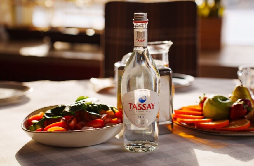 2025.02.13, Russia. Dinner setting with salad and water bottle on table