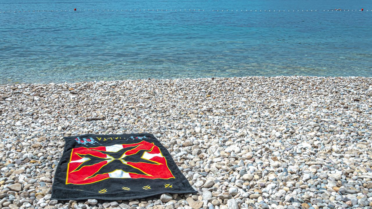 Beach towel on the shore in Lozica, Croatia