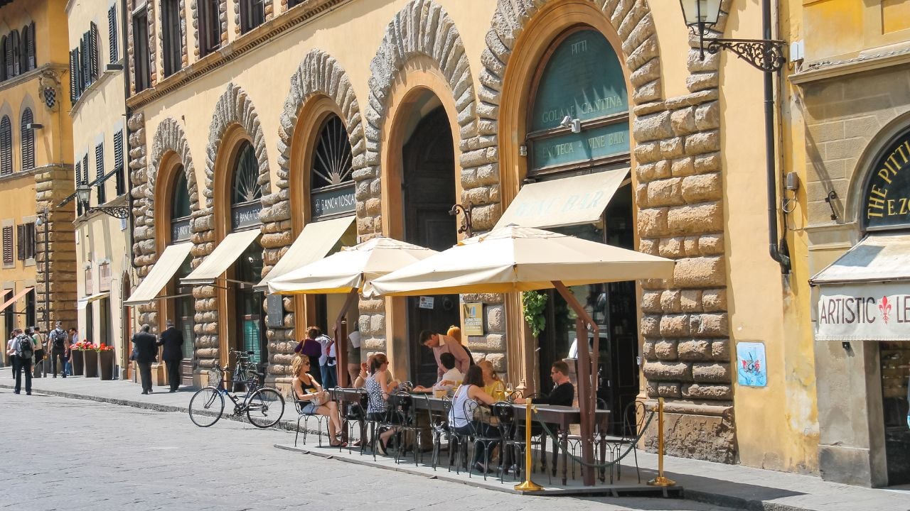 Tourists sitting at an outdoor café in Florence, Italy