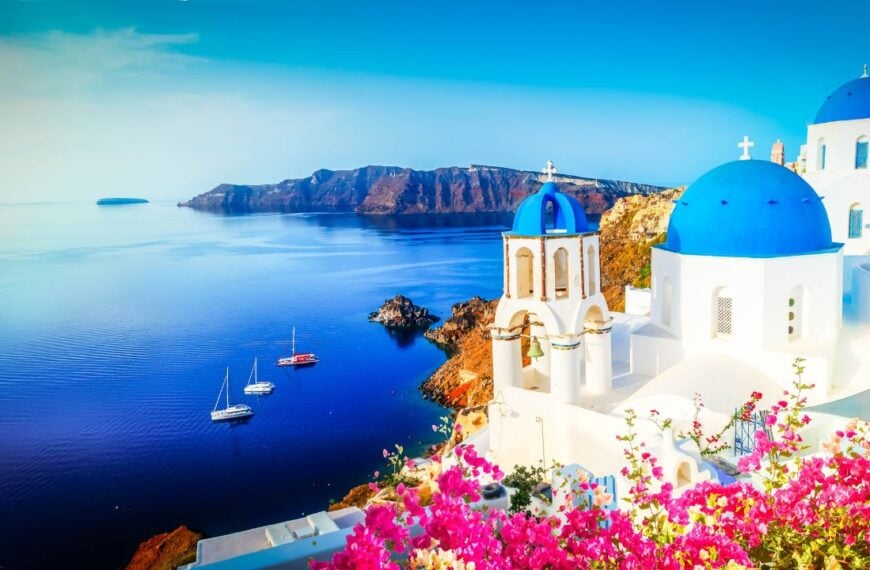 white church belfry and volcano caldera with sea landscape, beautiful details of Santorini island, Greece, banner