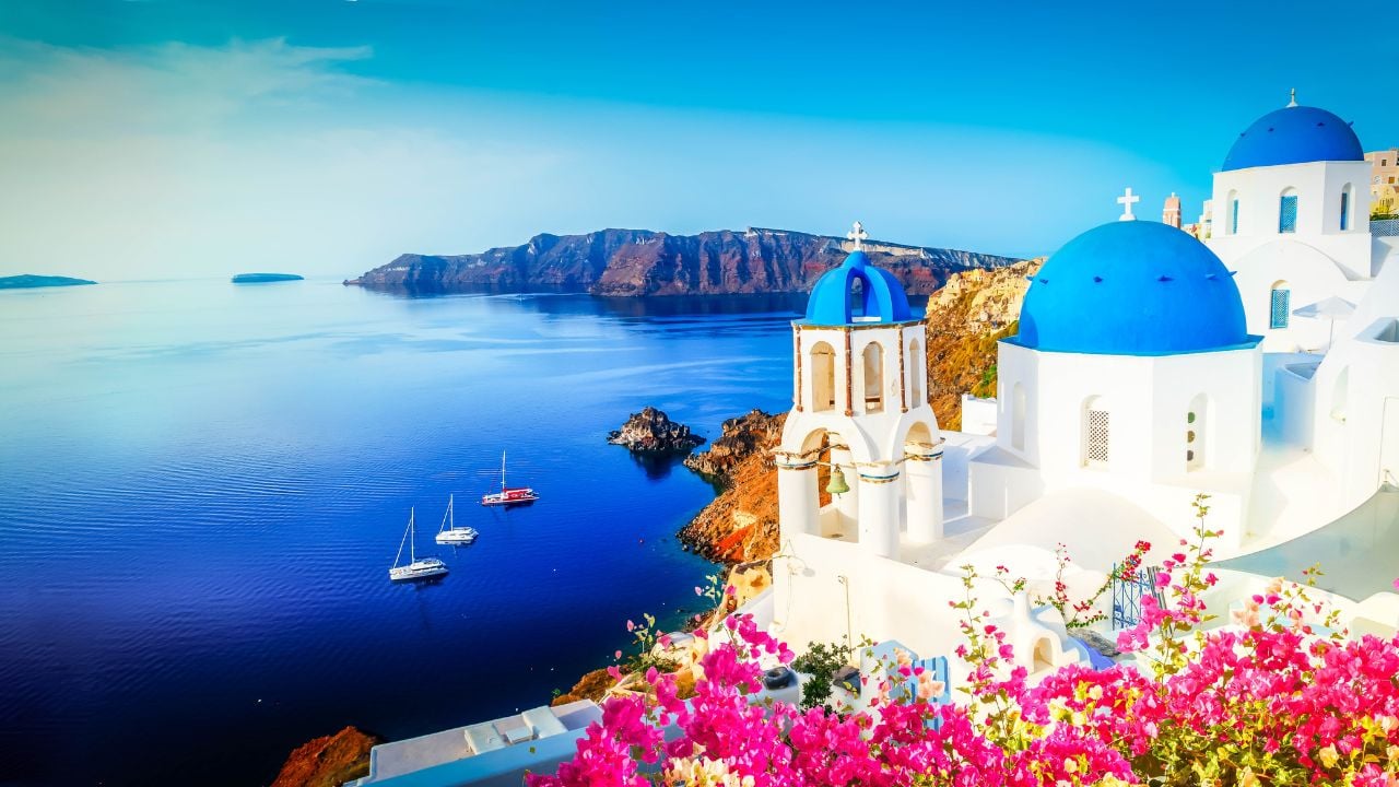 white church belfry and volcano caldera with sea landscape, beautiful details of Santorini island, Greece, banner