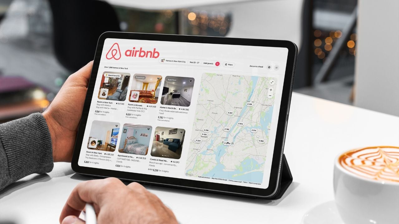 Traveler browsing vacation rental listings on a tablet