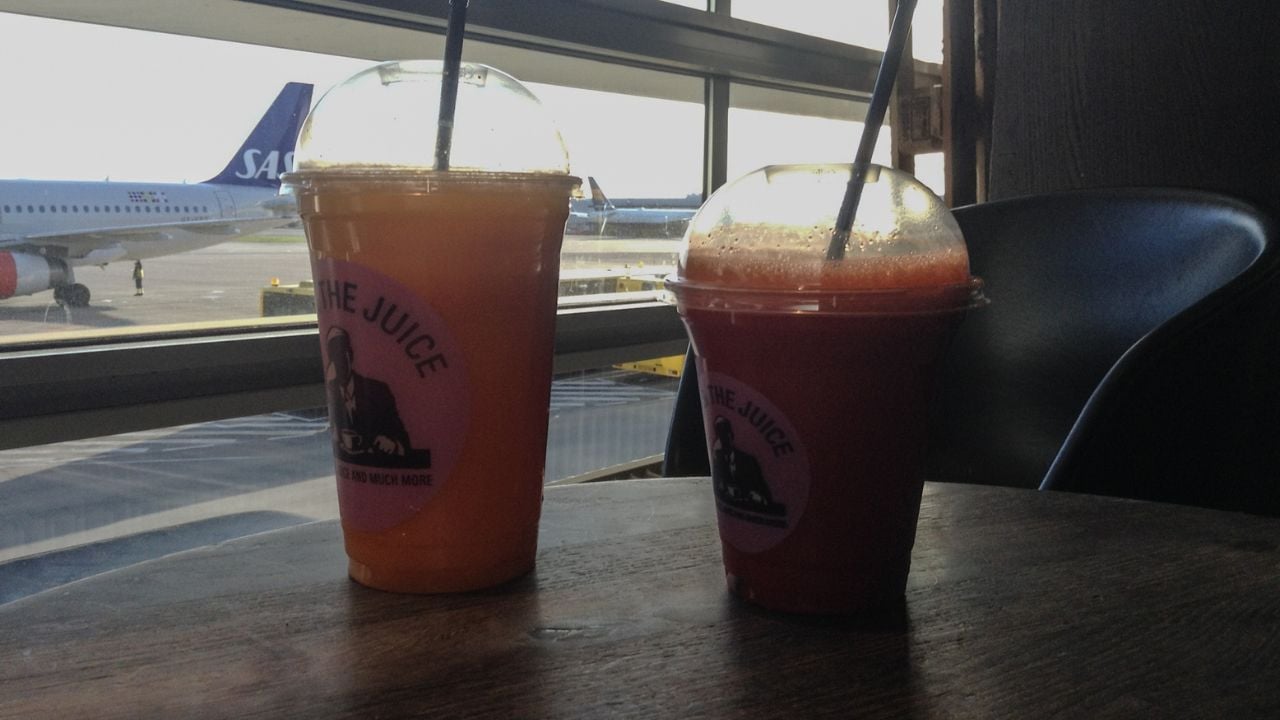 Coffee and bottled drinks on an airport table