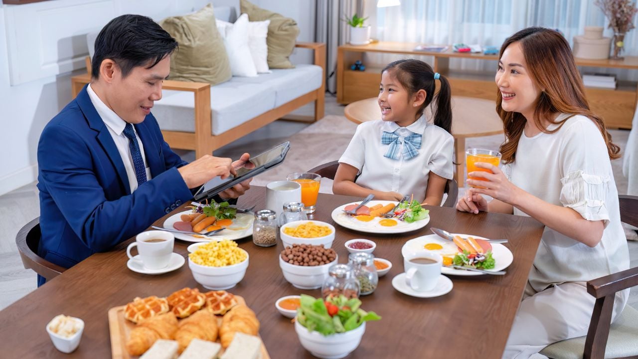 Family having breakfast together at home before leaving for the day