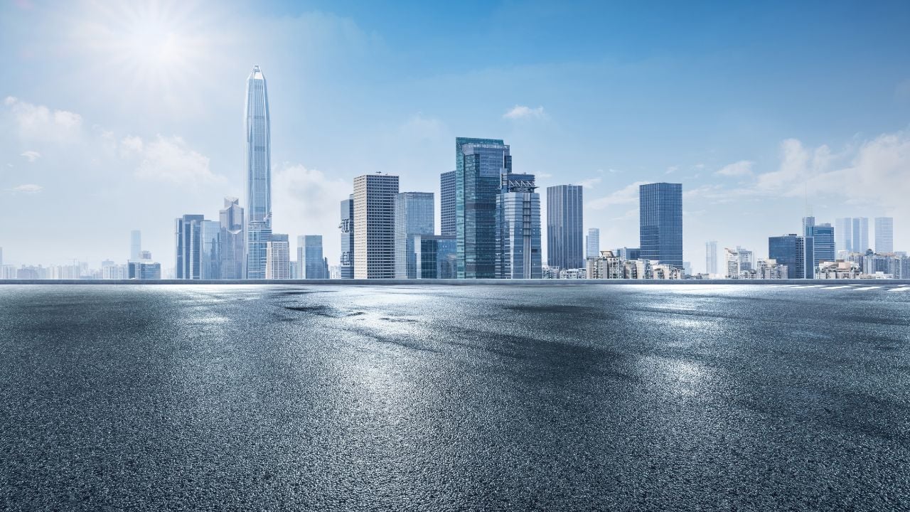 Asphalt road square with modern city buildings scenery in Shenzhen, China. Outdoor city background.