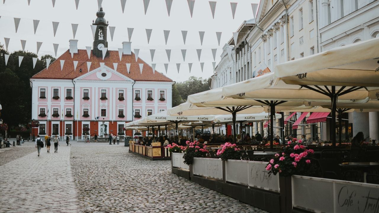 Town Hall Square in Tartu, Estonia, with cafés and restaurants on an autumn weekend