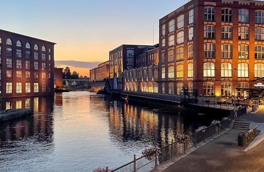 Tampere, Finland - August 14, 2025: View of historic Finlayson and Tampella factory buildings on both banks of Tammerkoski river, industrial heritage and travel