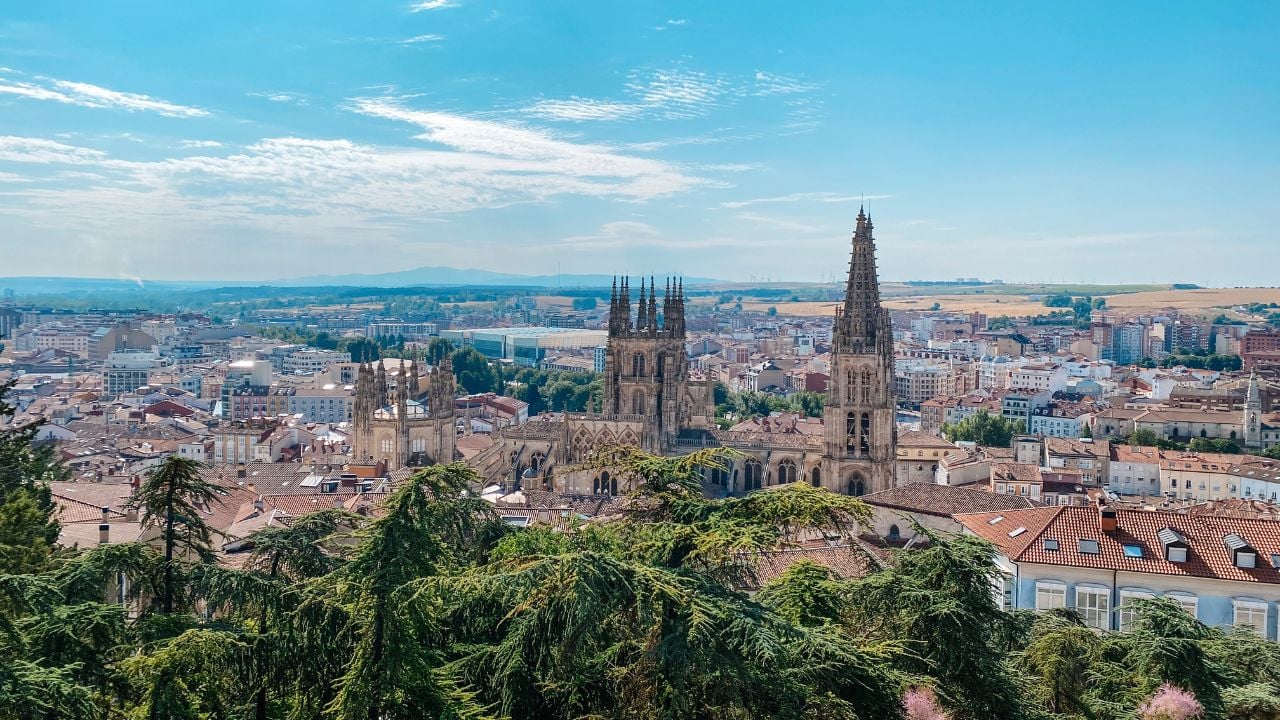 Panoramic view of Burgos, Spain, with cathedral towers above the old town rooftops