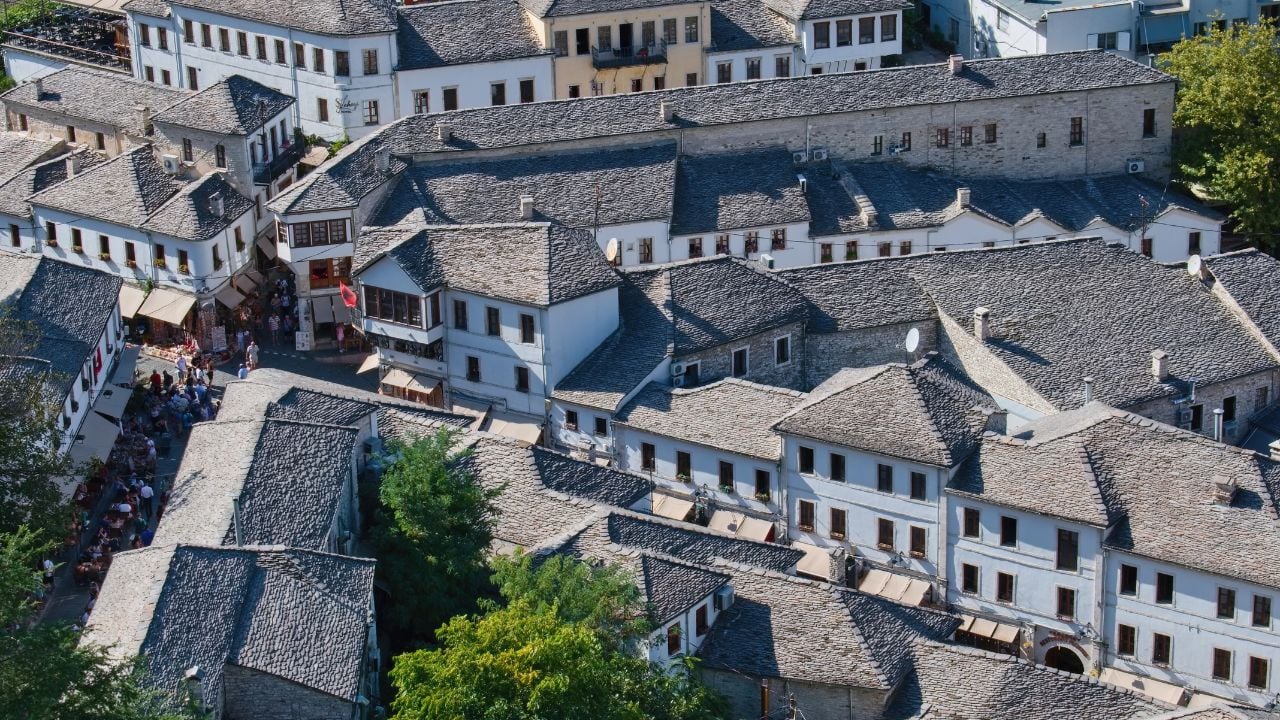 Old town of Gjirokastër, Albania, with stone houses, slate roofs, and cobbled streets