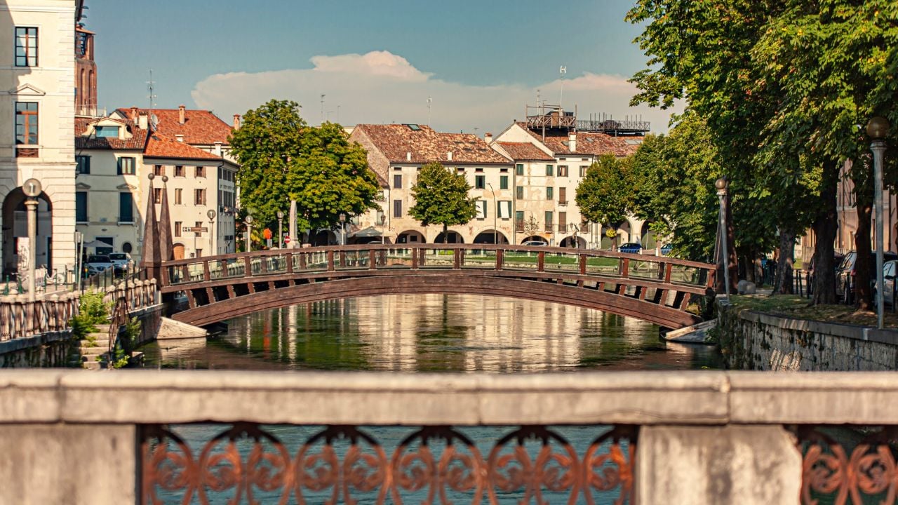 Cagnan Grande canal with a wooden bridge and typical buildings in Treviso, Italy