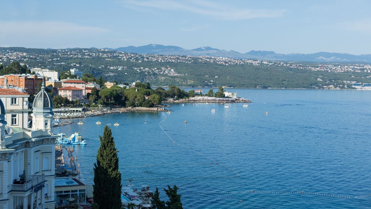 Coastal view of Opatija, Croatia, with historic architecture, Adriatic Sea, beaches, and mountains