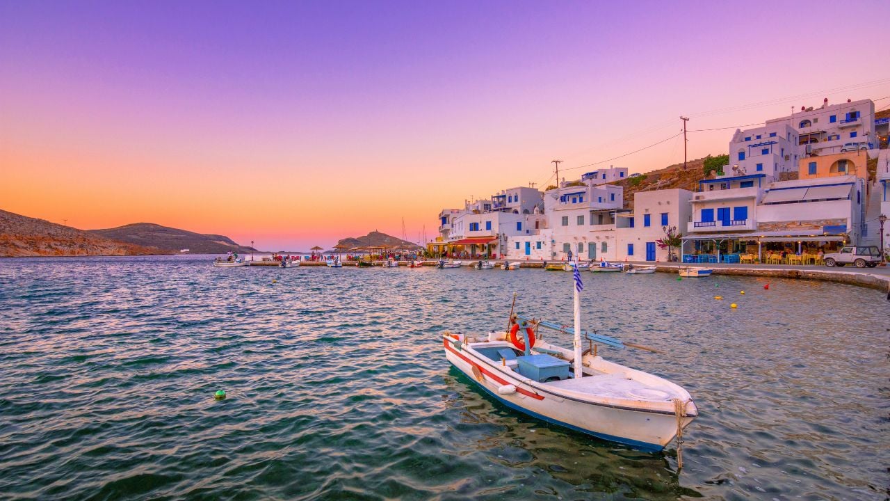 The small peaceful old harbor of picturesque Panormos at sunset, Tinos island, Greece.