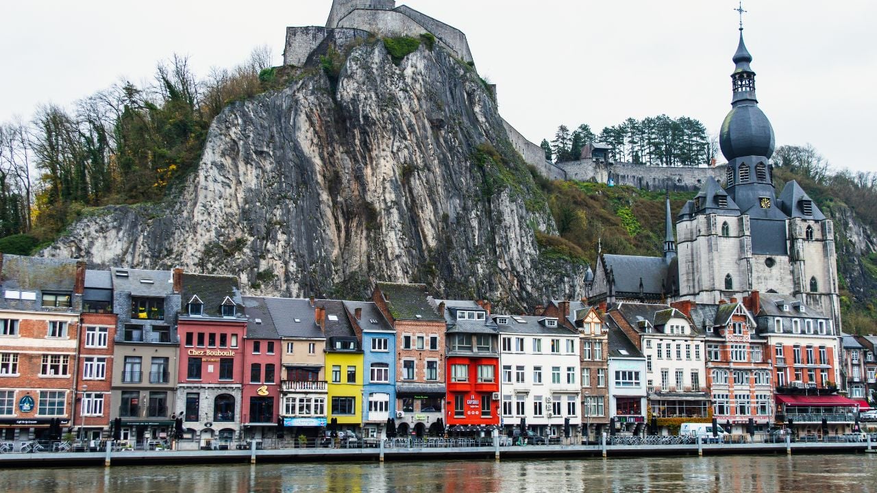 The Citadel of Dinant is a fortress in Picturesque Dinant town in Belgium. The view of Dinant Citadel and Collegiate Church of Notre Dame de Dinant over the Meuse river.